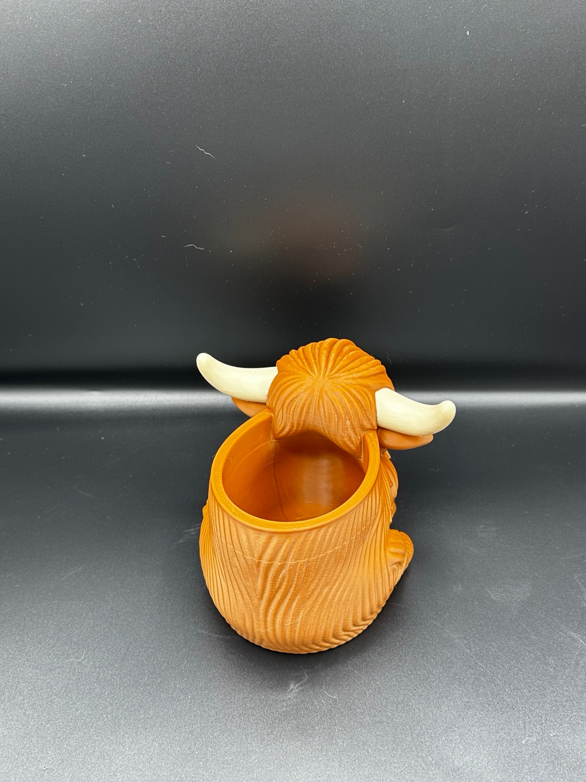 Highland cow pen pot showing opening