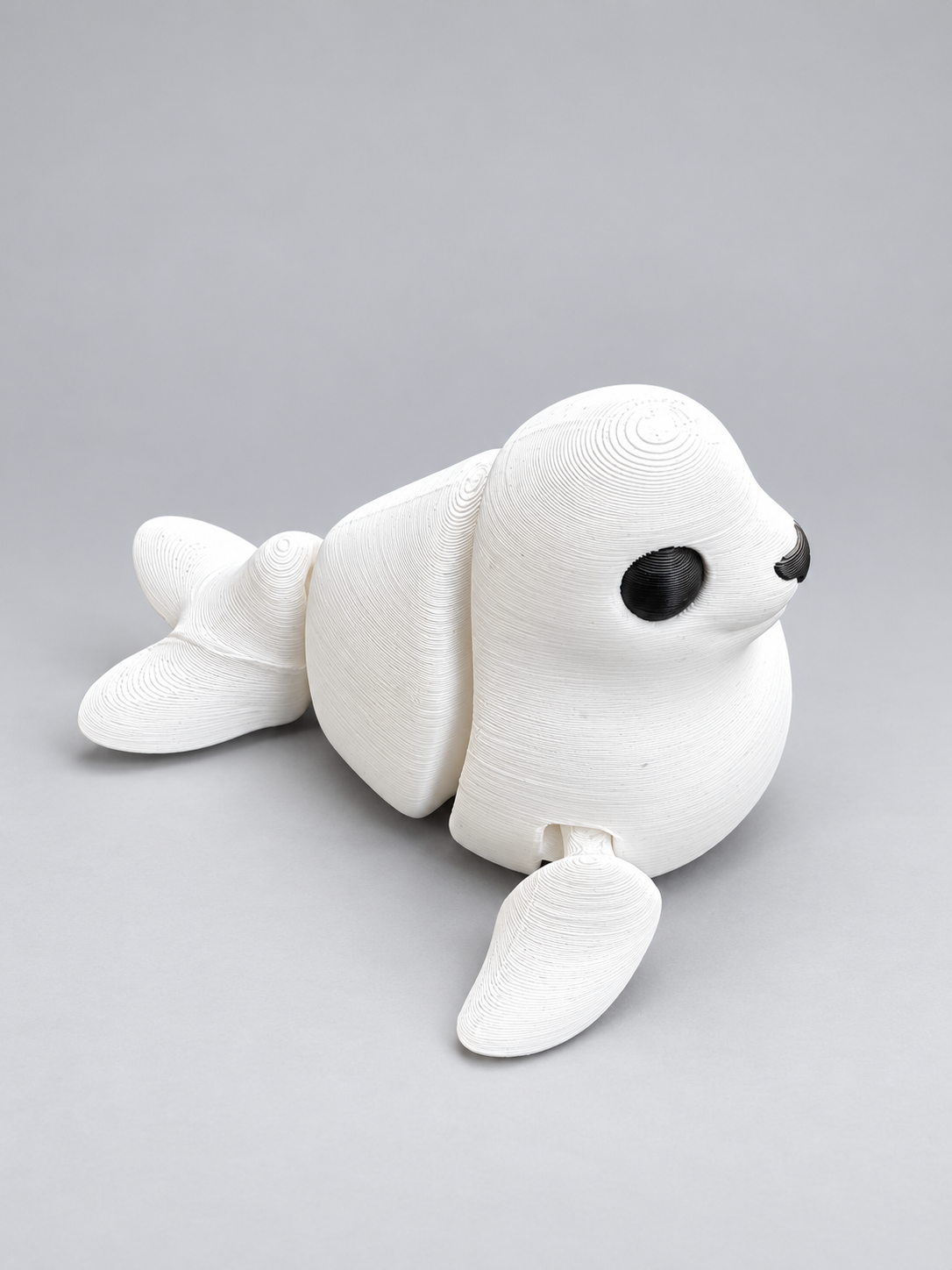 Articulated seal fidget three-quarter view