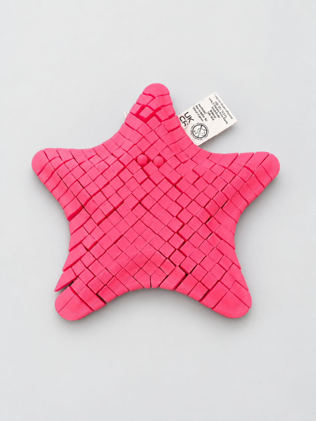 Articulated starfish fidget folded in the hand