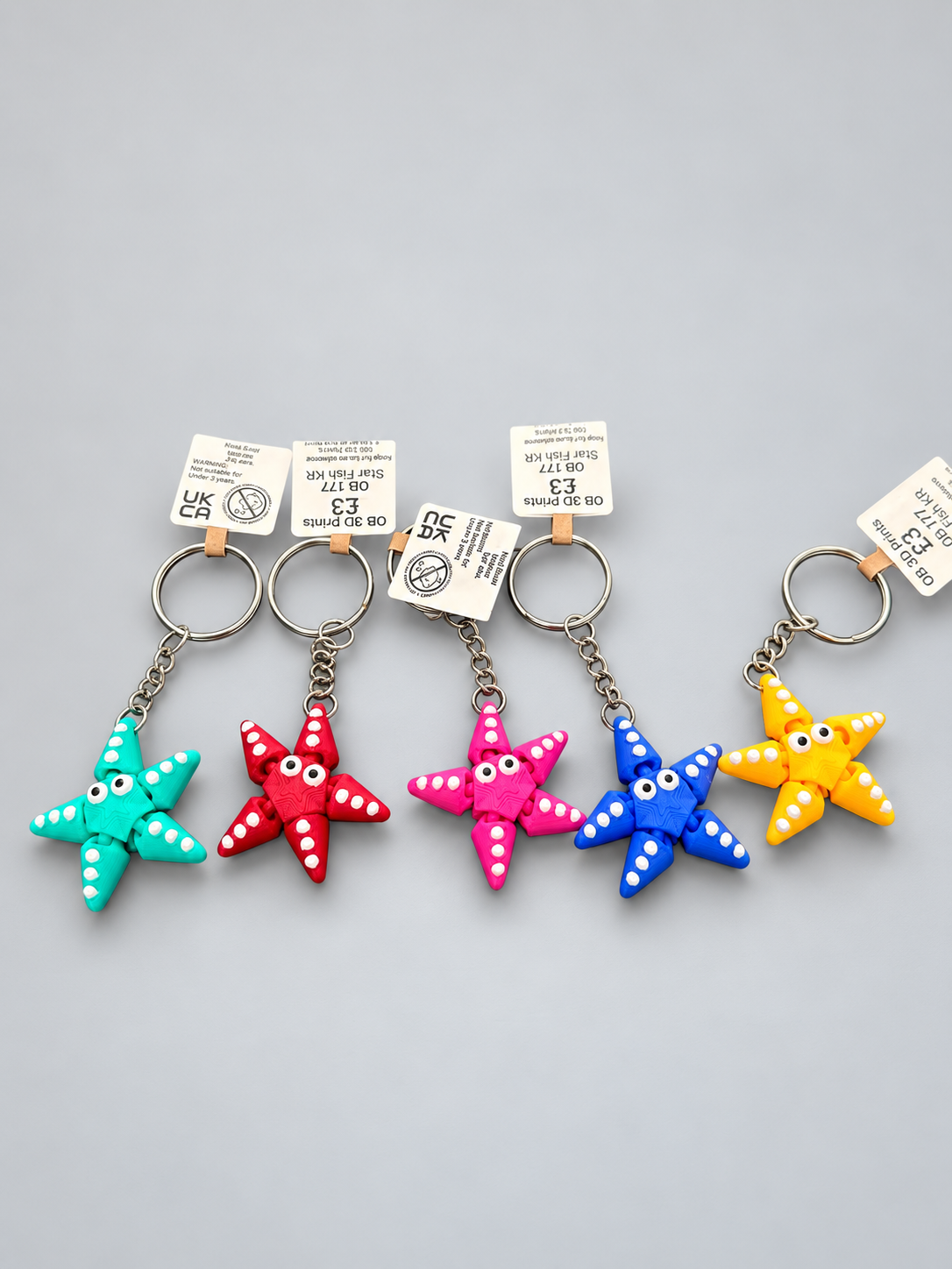 Articulated starfish keychains in five colours