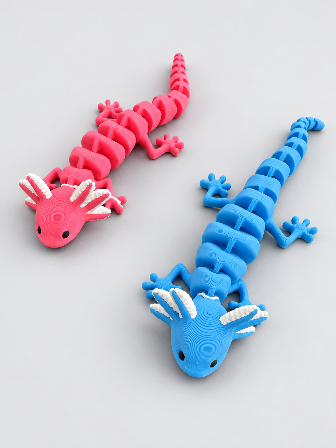Pink and blue articulated axolotl pair