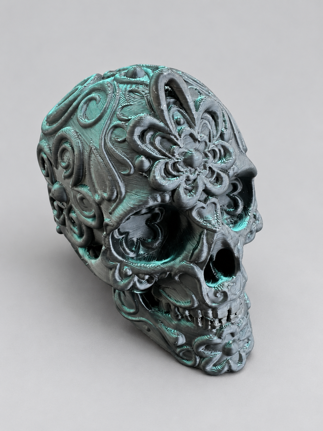 Candy skull ornament in Metallic Green/Black on a soft grey studio background