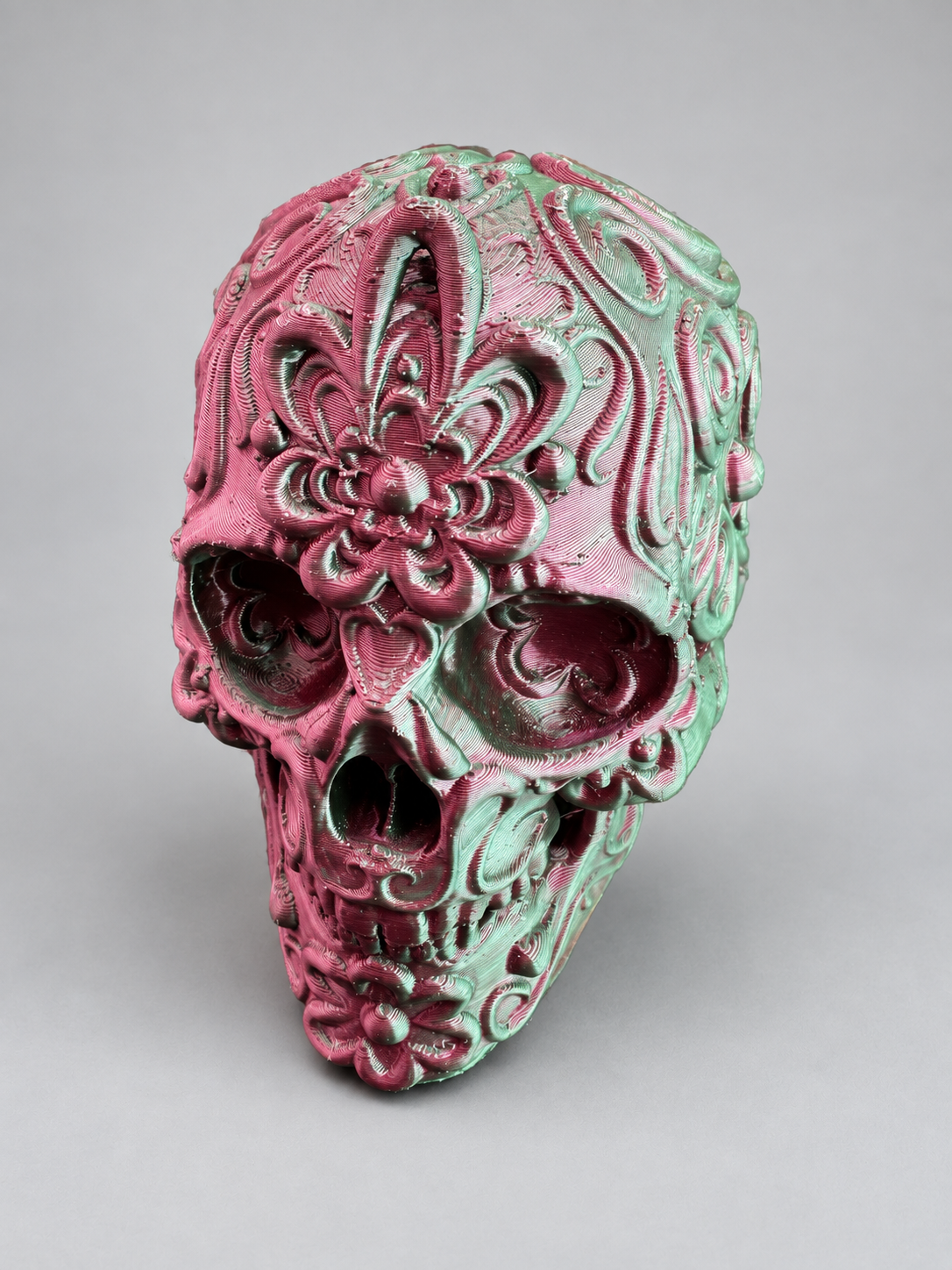 Candy skull ornament in Metallic Red/Black on a soft grey studio background