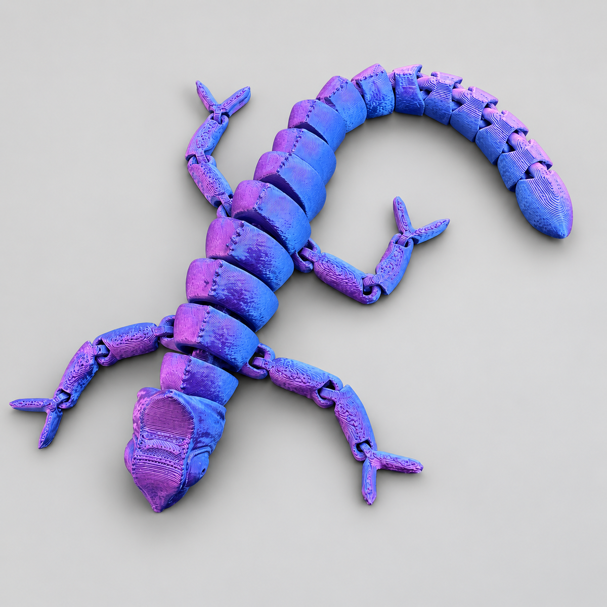 Metallic blue and purple articulated chameleon fidget