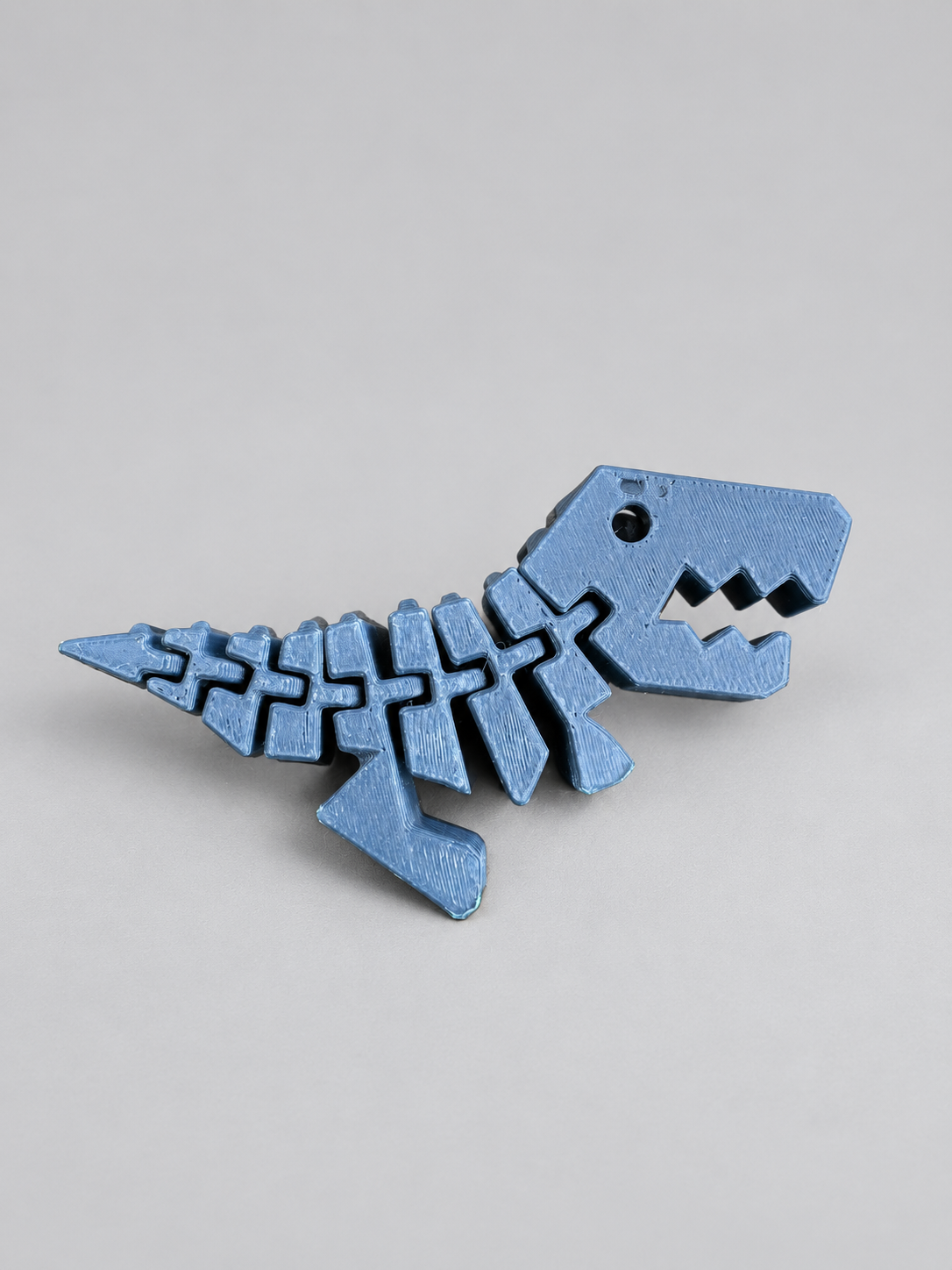 Dark blue Flexi Rexies articulated dinosaur fidget
