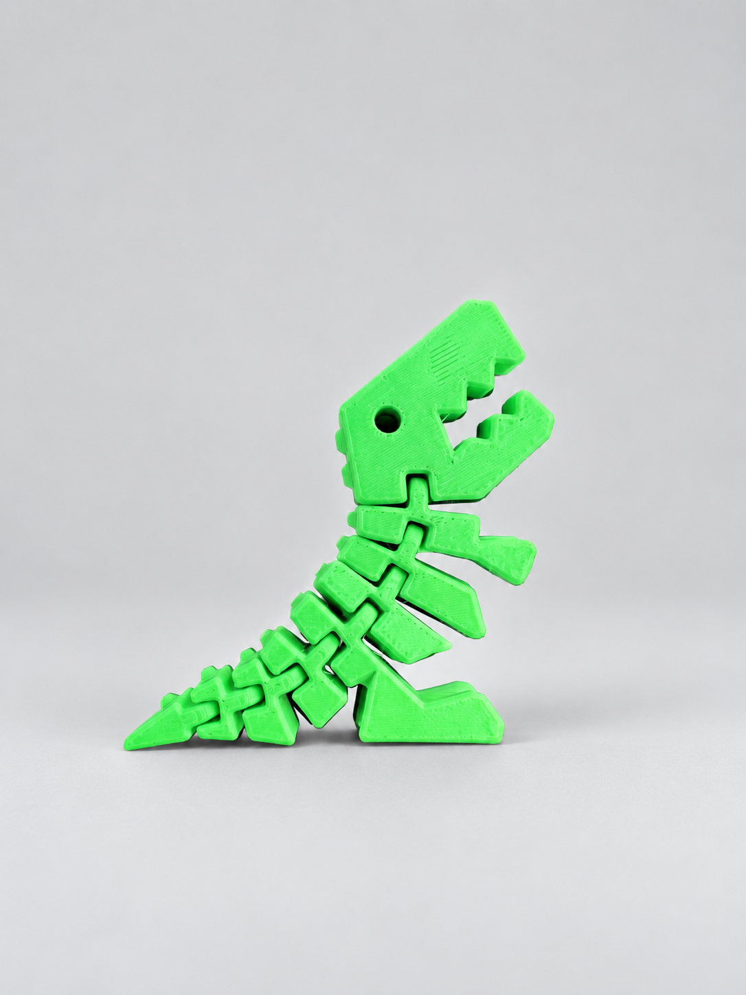Green Flexi Rexies articulated dinosaur fidget