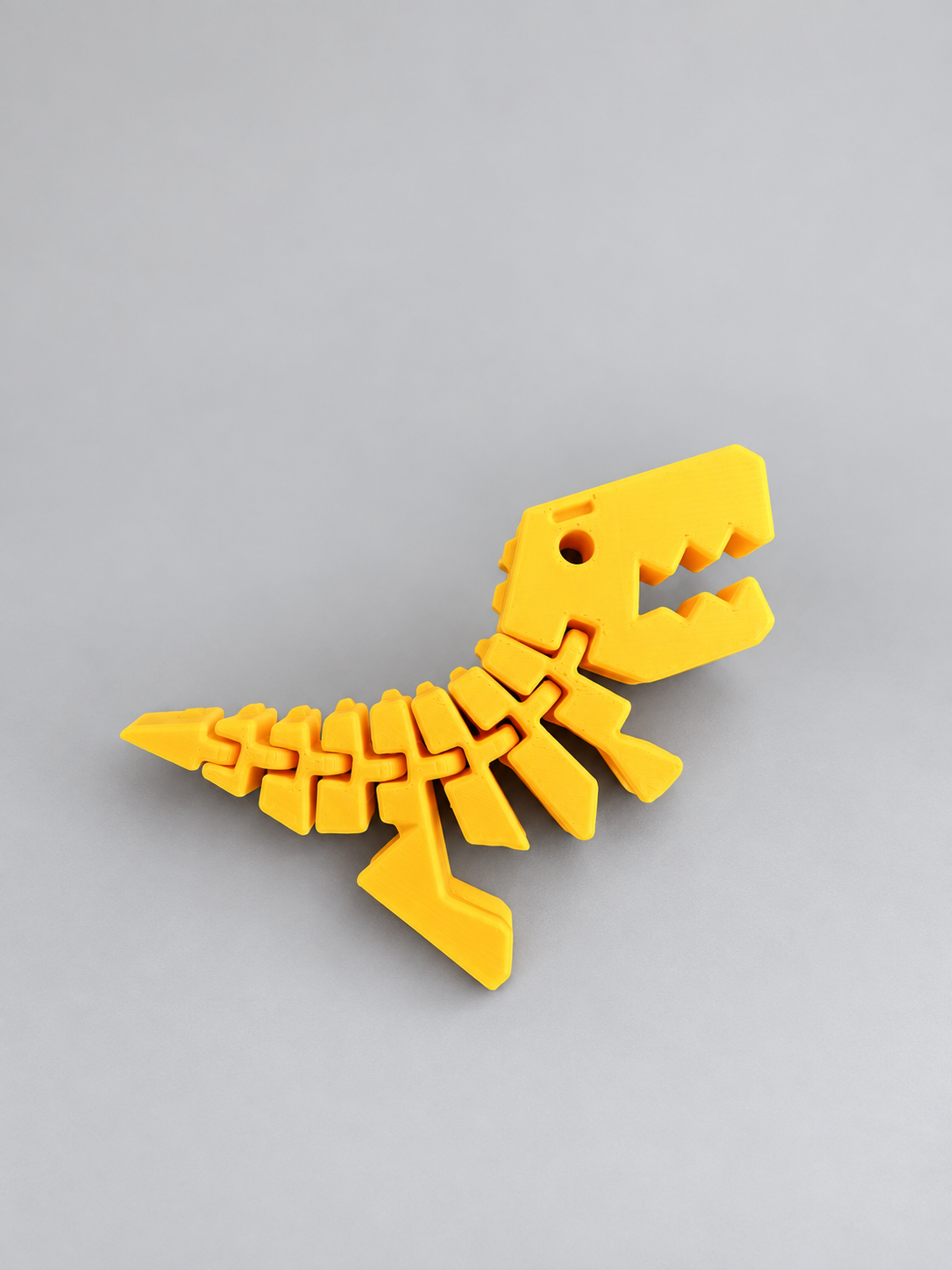 Yellow Flexi Rexies articulated dinosaur fidget