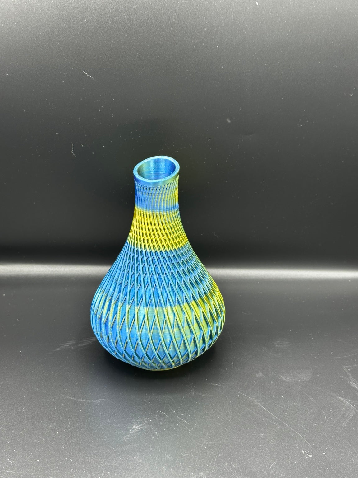 Fluted spiral vase in a metallic blue and gold finish