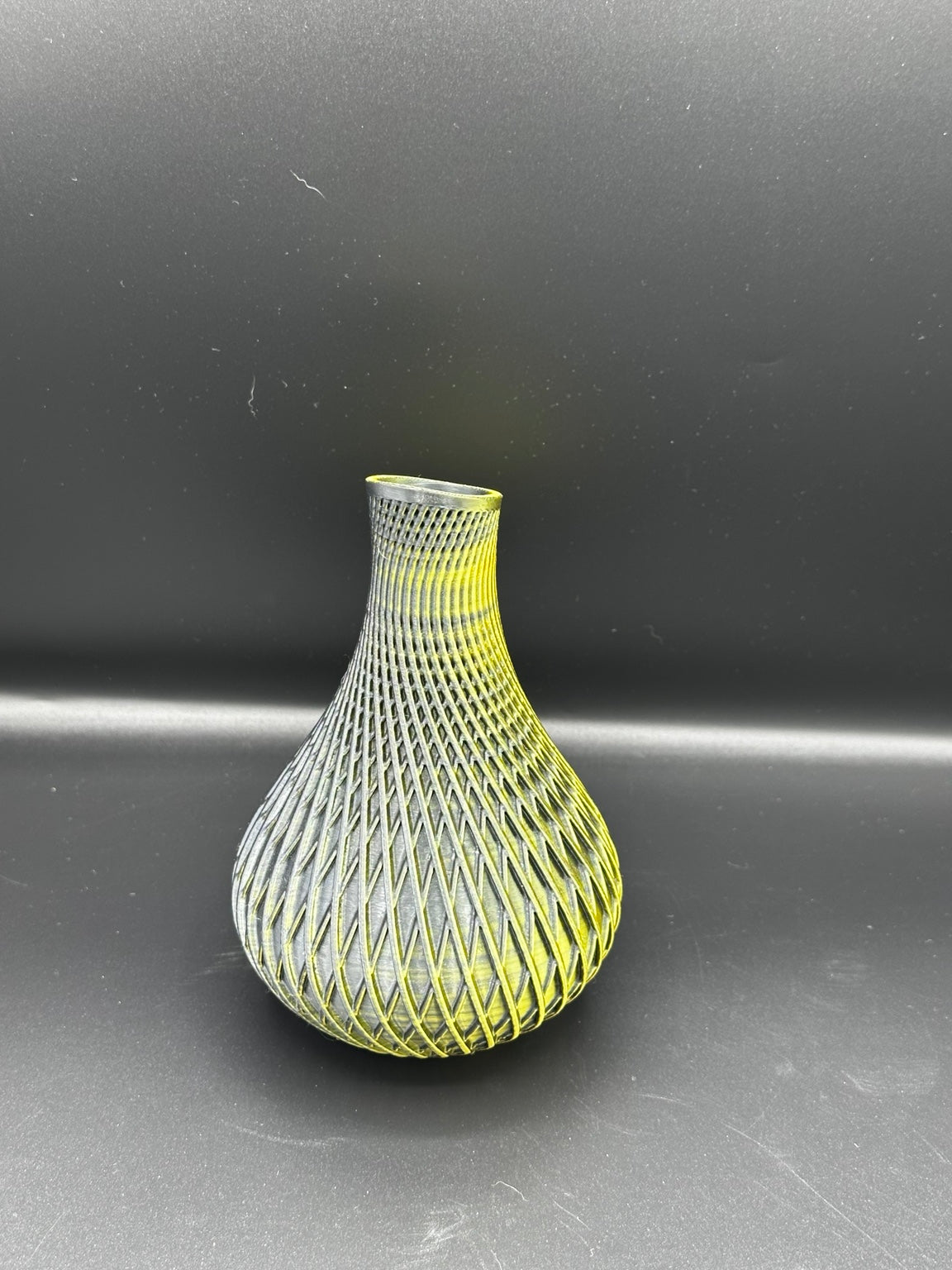 Fluted spiral vase in a metallic gold and black finish