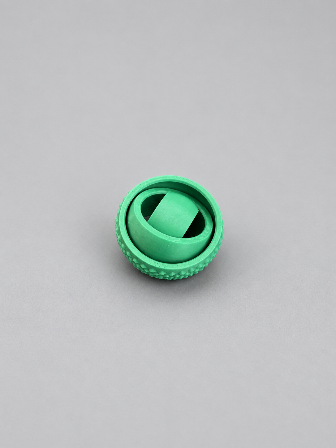 Green fidget gyro spinner partially opened