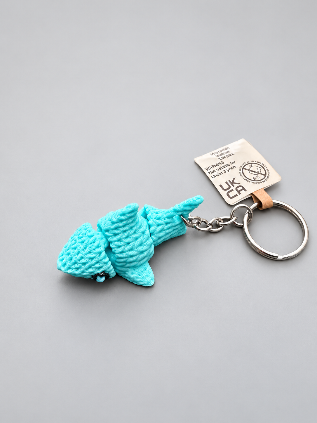 Blue knitted-style articulated shark keychain