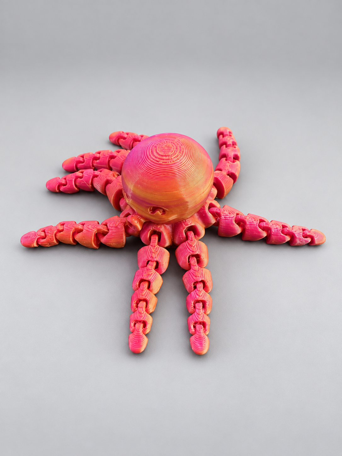 Pink and gold mini articulated octopus
