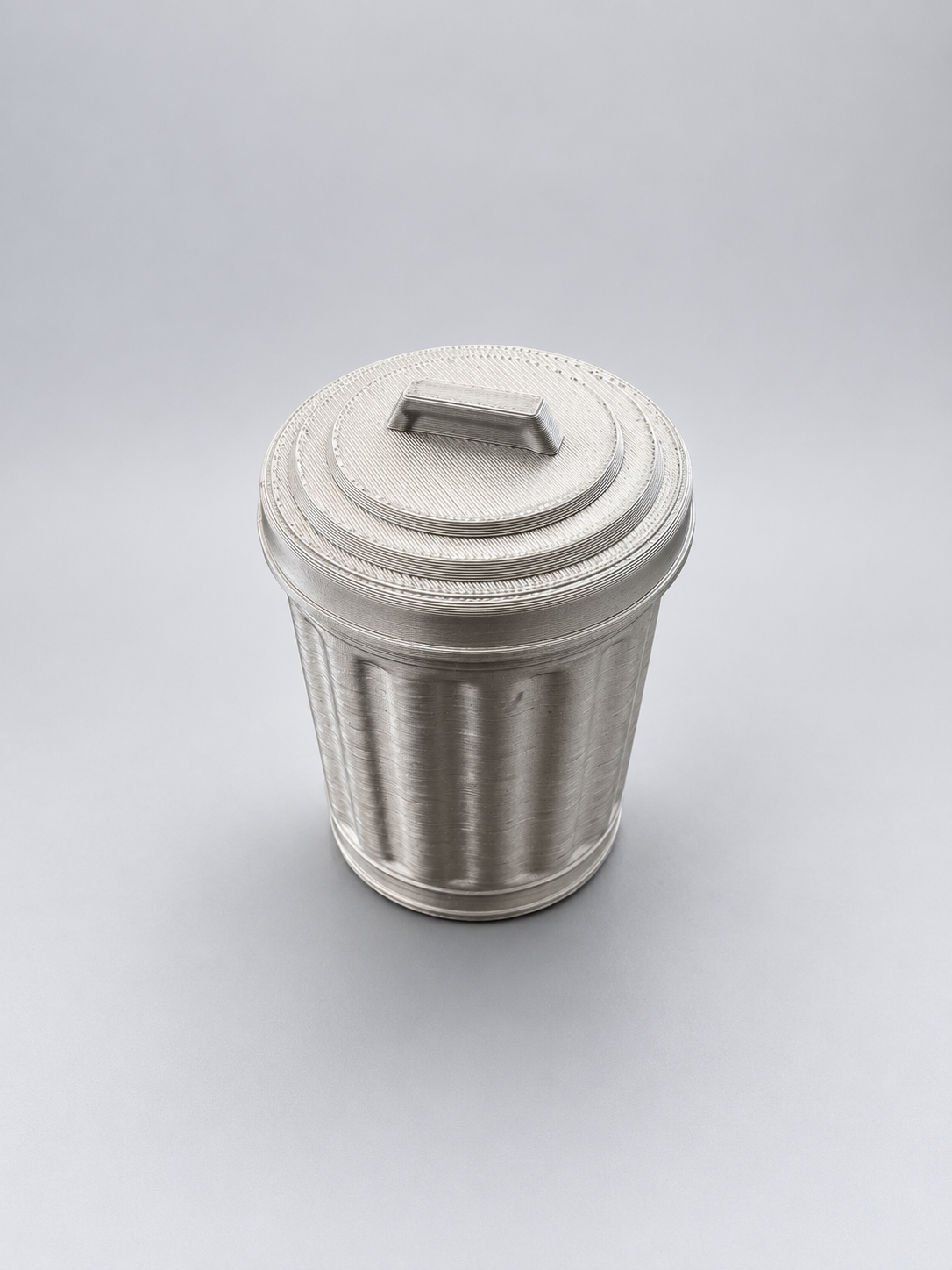 Silver miniature bin with twist-and-lock lid closed